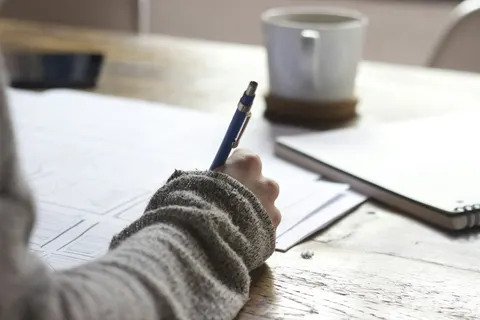 Paper and a pen on a working surface