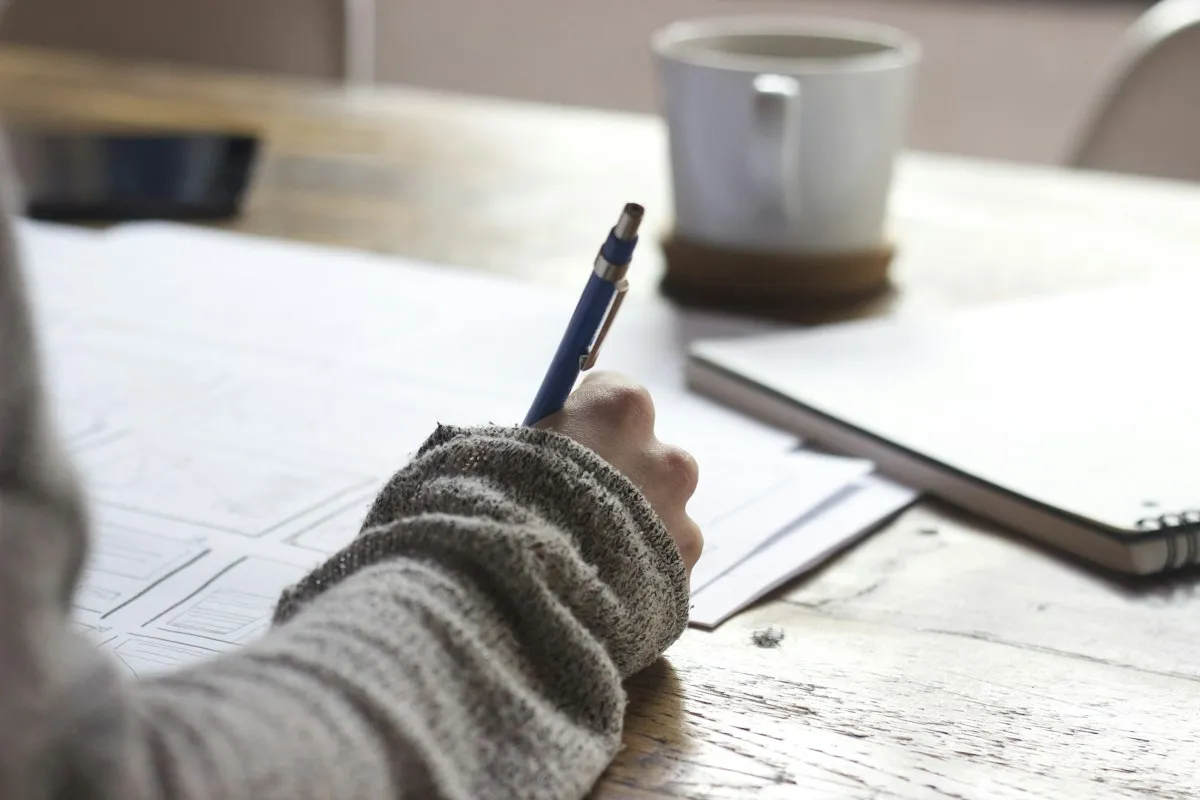 Paper and a pen on a working surface
